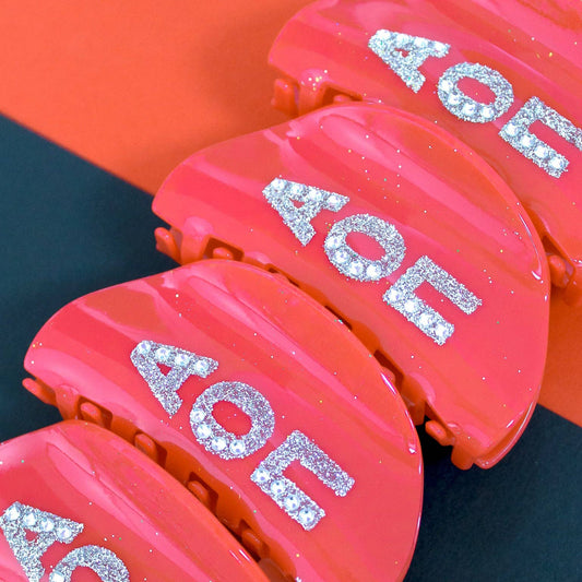 Red containers with 'AOE' text on a dark surface
