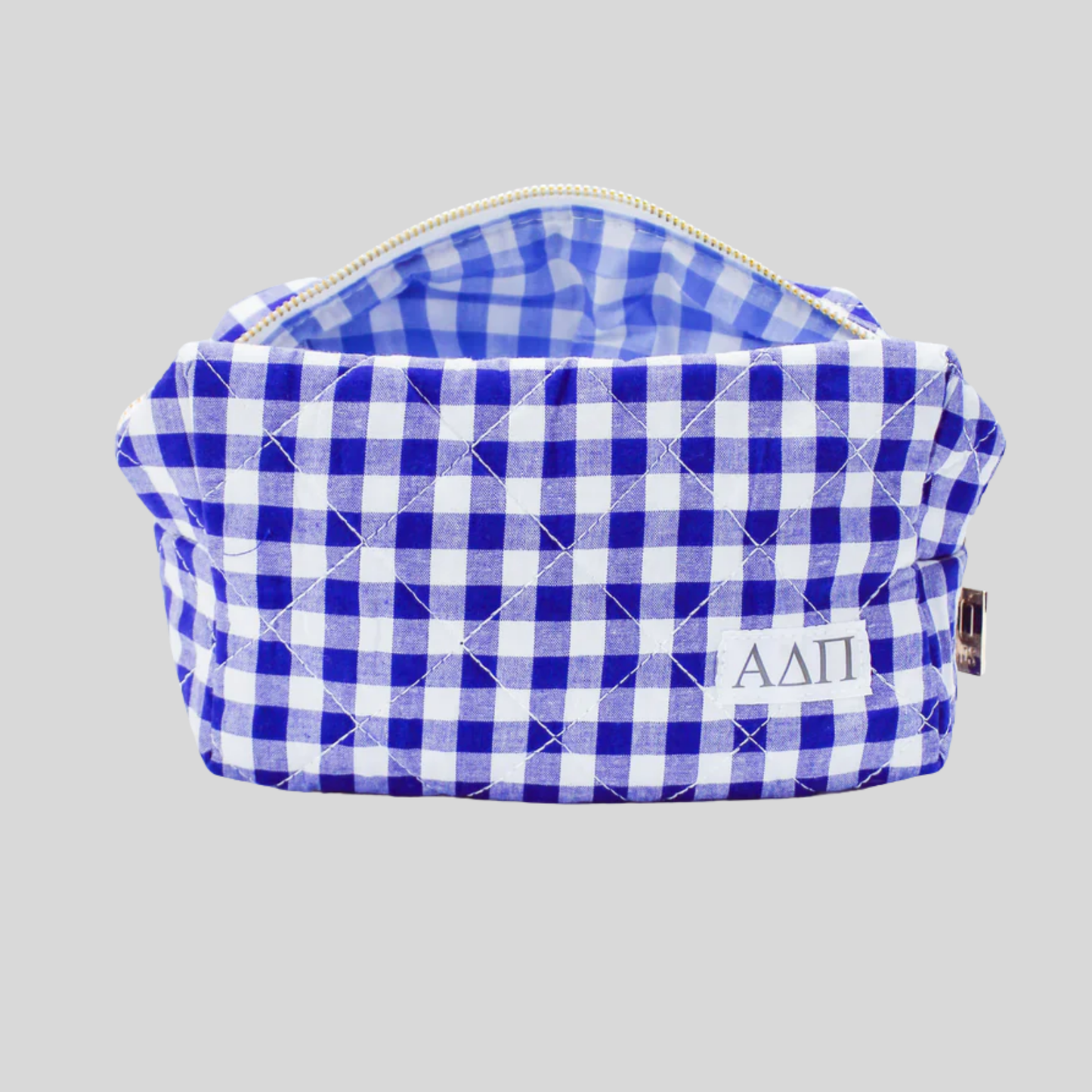 Blue and white checkered bag with a logo on a gray background