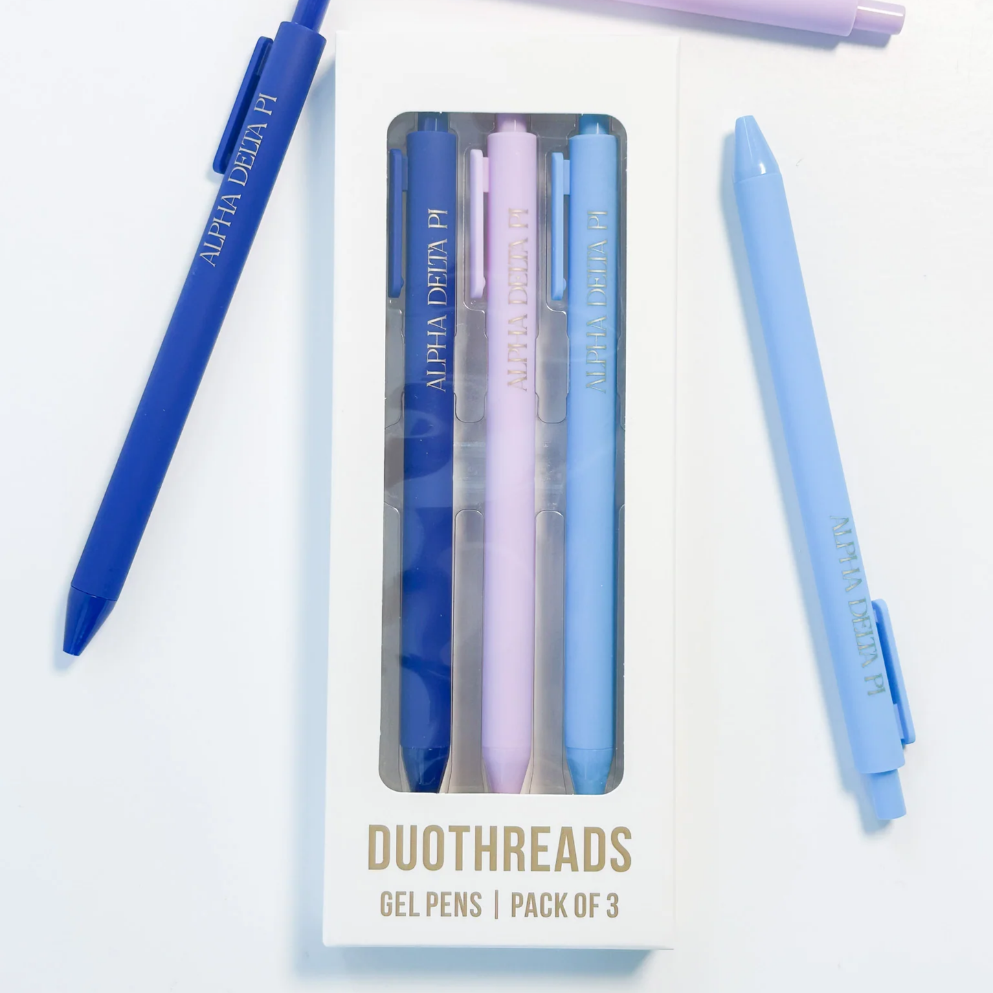 Set of gel pens with packaging labeled 'Duothreads' on a white background