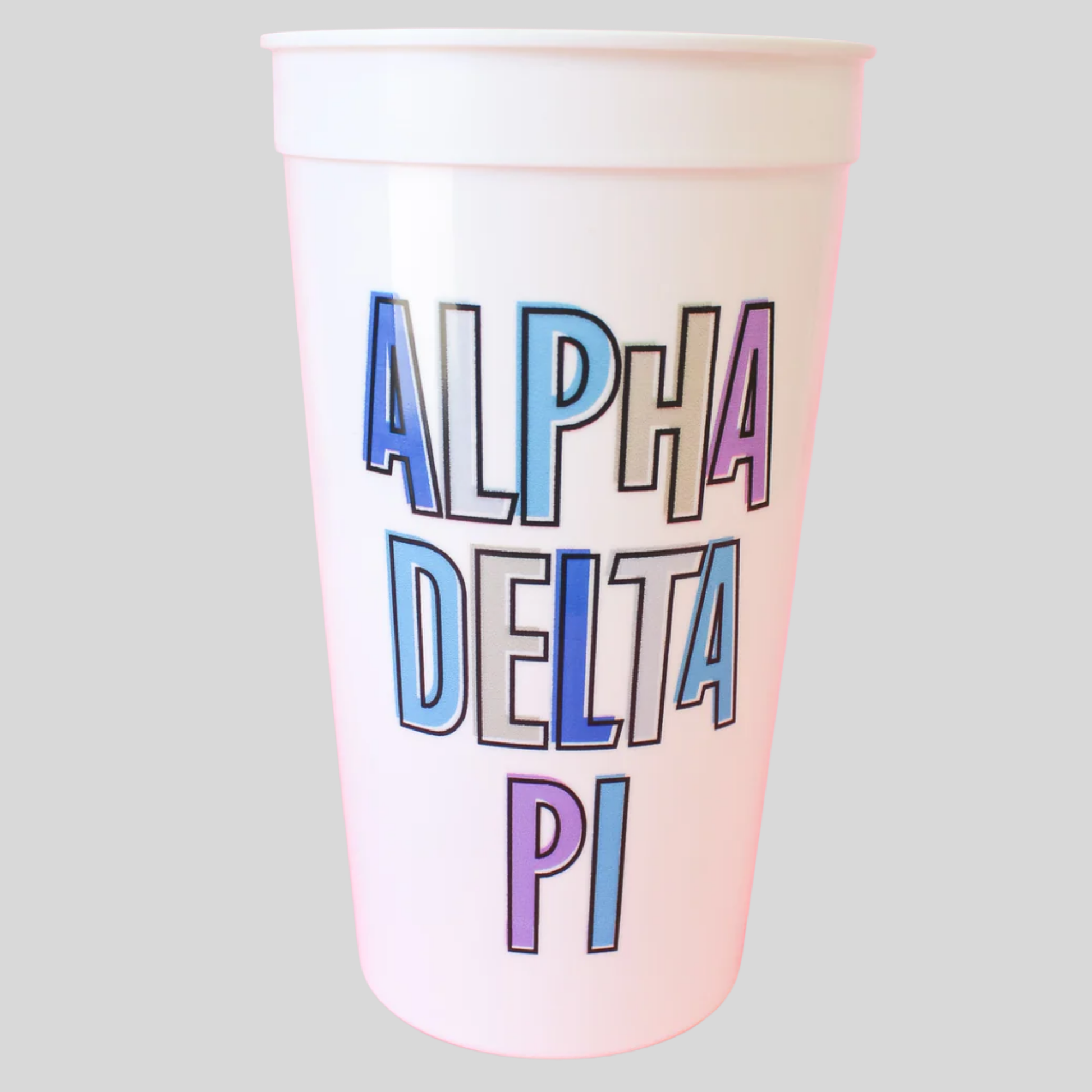 Alpha Delta Pi cup with pastel-colored text on a light gray background