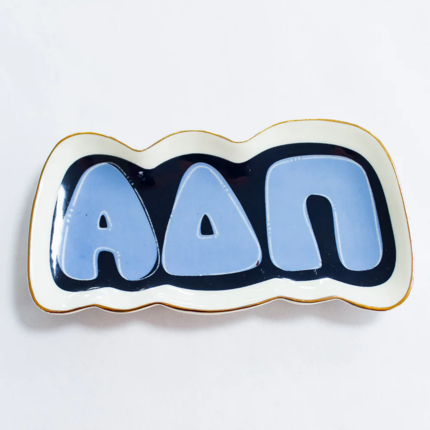Decorative plate with blue letters on a white background