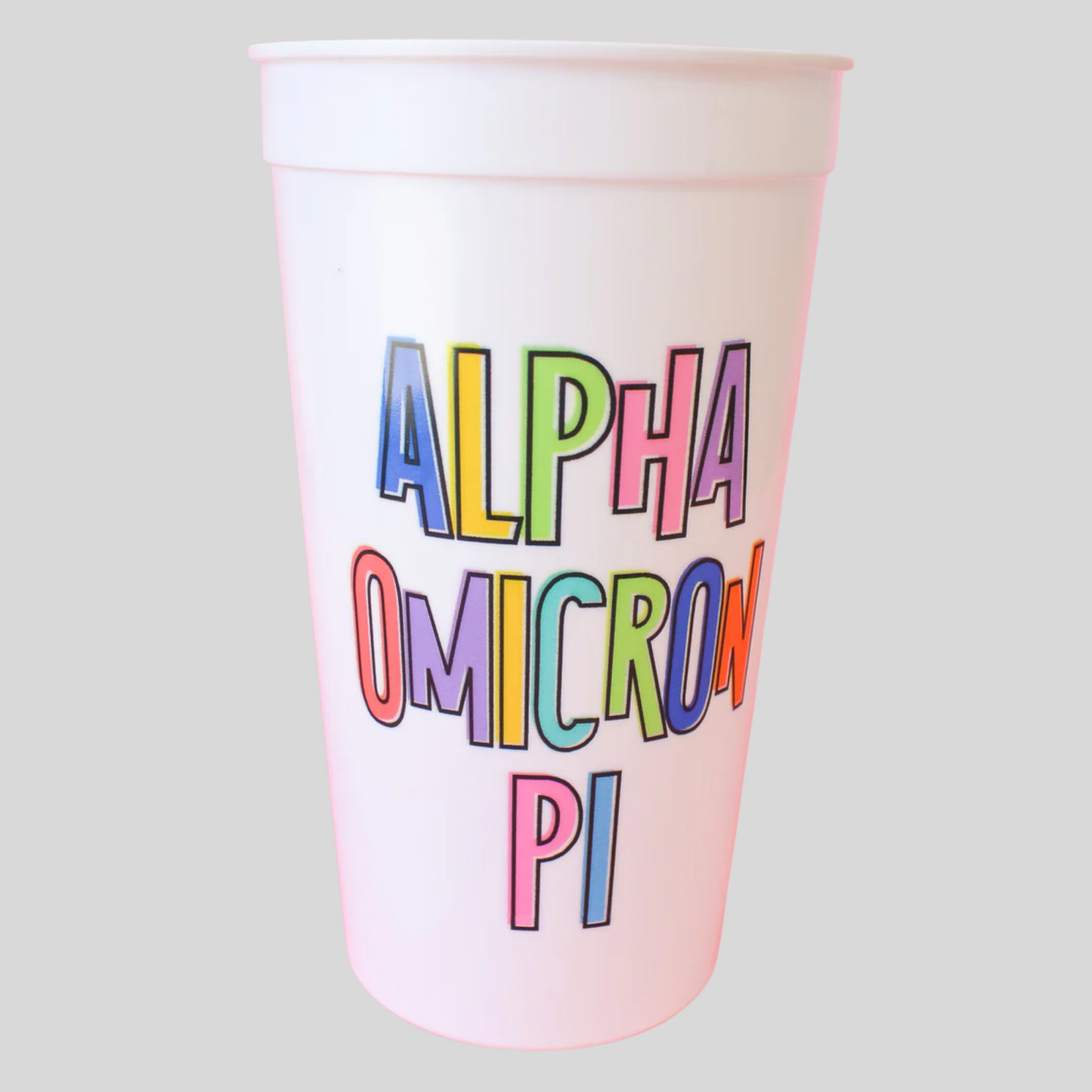 White cup with 'Alpha Omicron Pi' in colorful letters on a light gray background