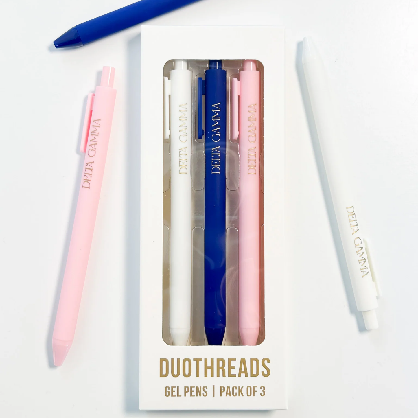 Pack of three gel pens in pink, blue, and white with 'Delta Gamma' branding on a white background.