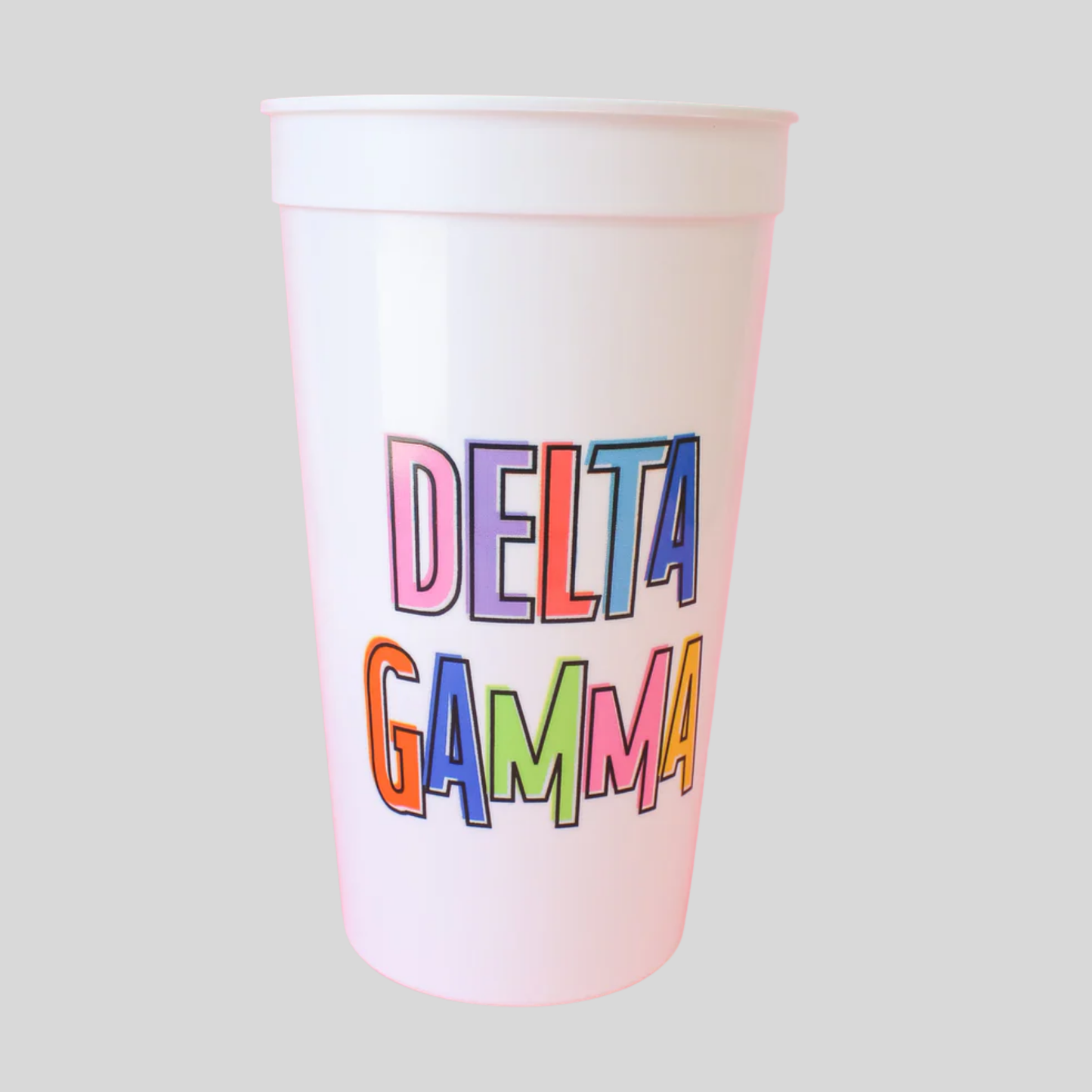 Colorful 'Delta Gamma' text on a white cup against a light gray background