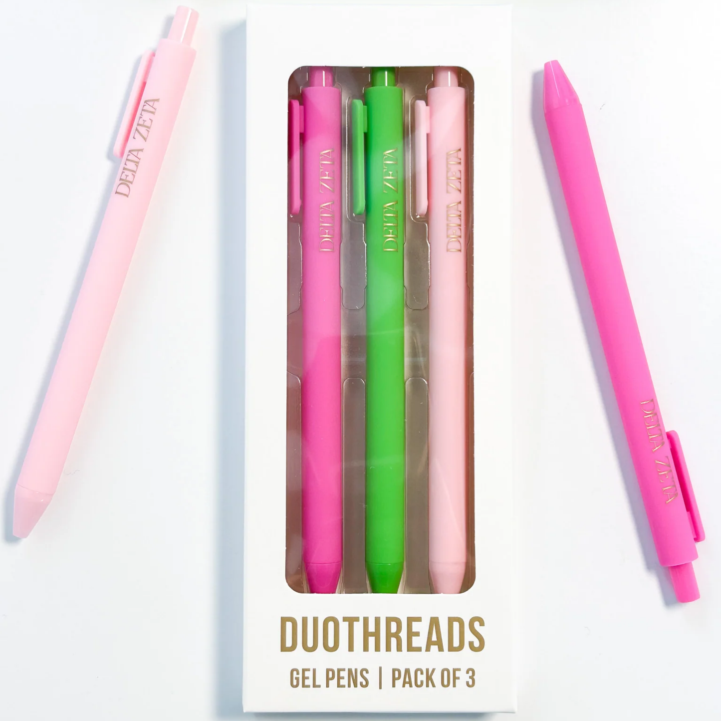 Set of three gel pens in pink, green, and white with 'Delta Zeta' branding on a white background.