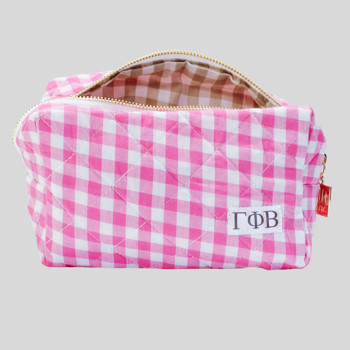 Pink and white checkered pouch with 'Gamma Phi Beta' monogram on a light gray background