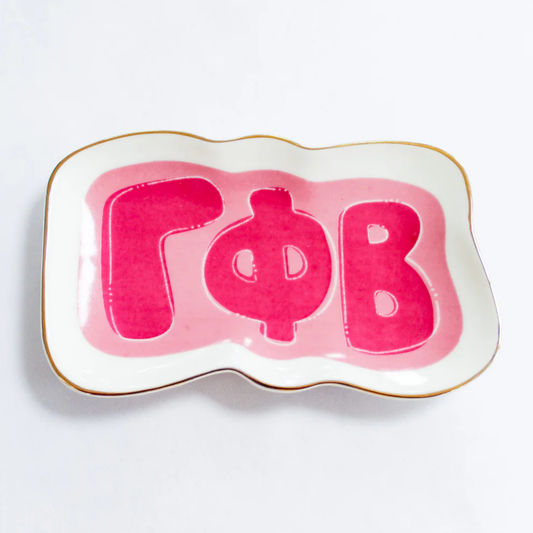 Decorative plate with pink letters 'Gamma Phi Beta' on a white background