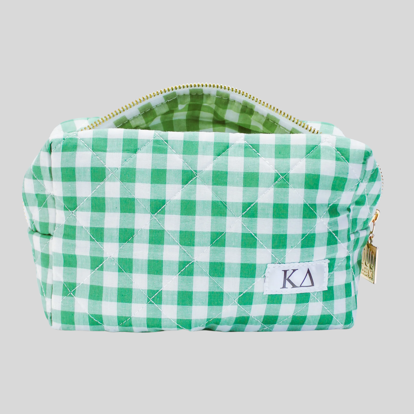 Green and white checkered pouch with 'Kappa Delta' initials on a gray background