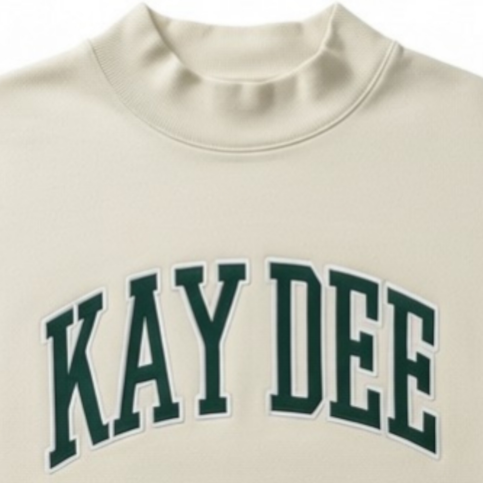 Beige sweatshirt with 'KAY DEE' printed in green on a white background