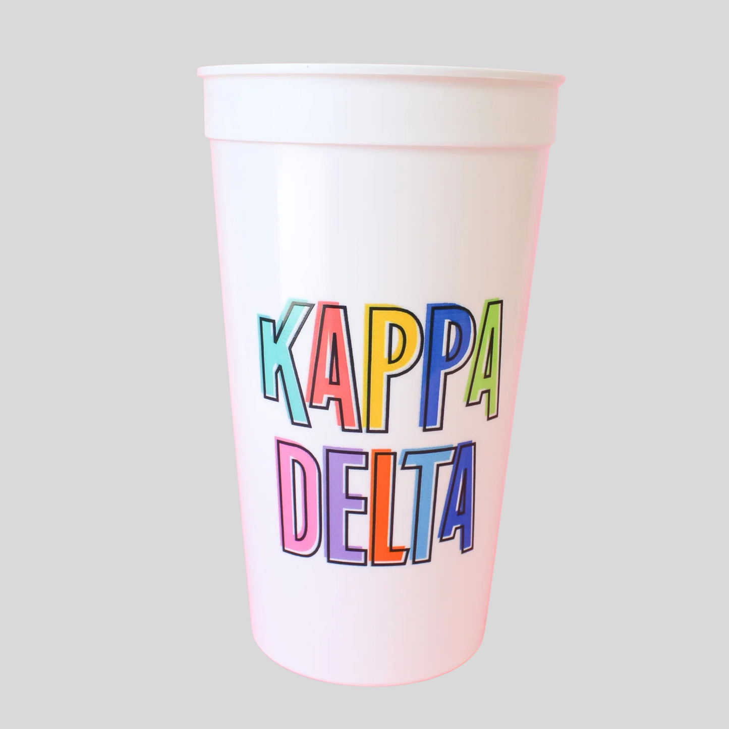 Colorful 'Kappa Delta' text on a white cup against a light gray background