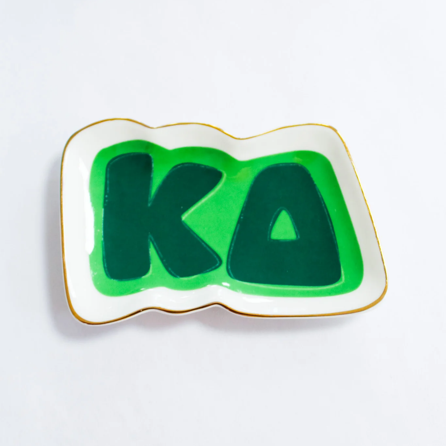 Green and gold 'KD' design on a white background