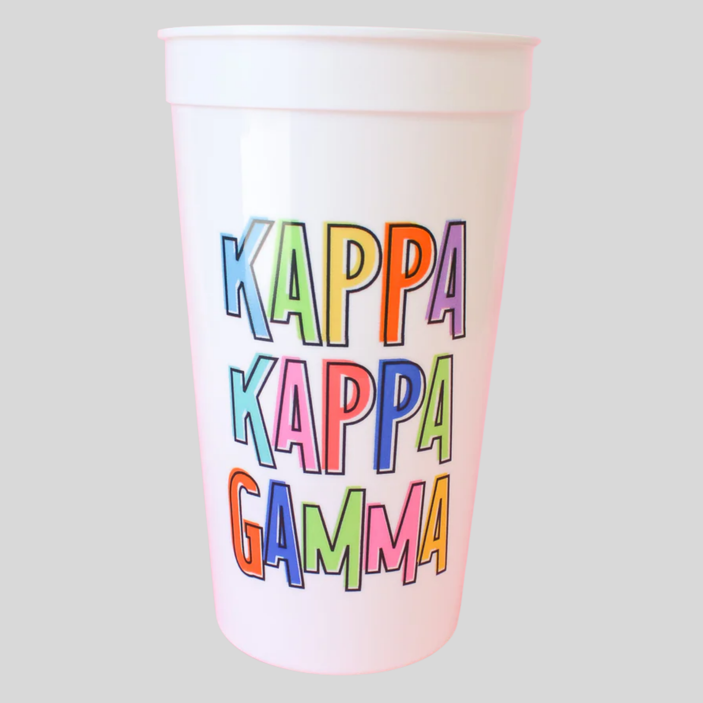 Colorful Kappa Kappa Gamma text on a white cup against a light gray background