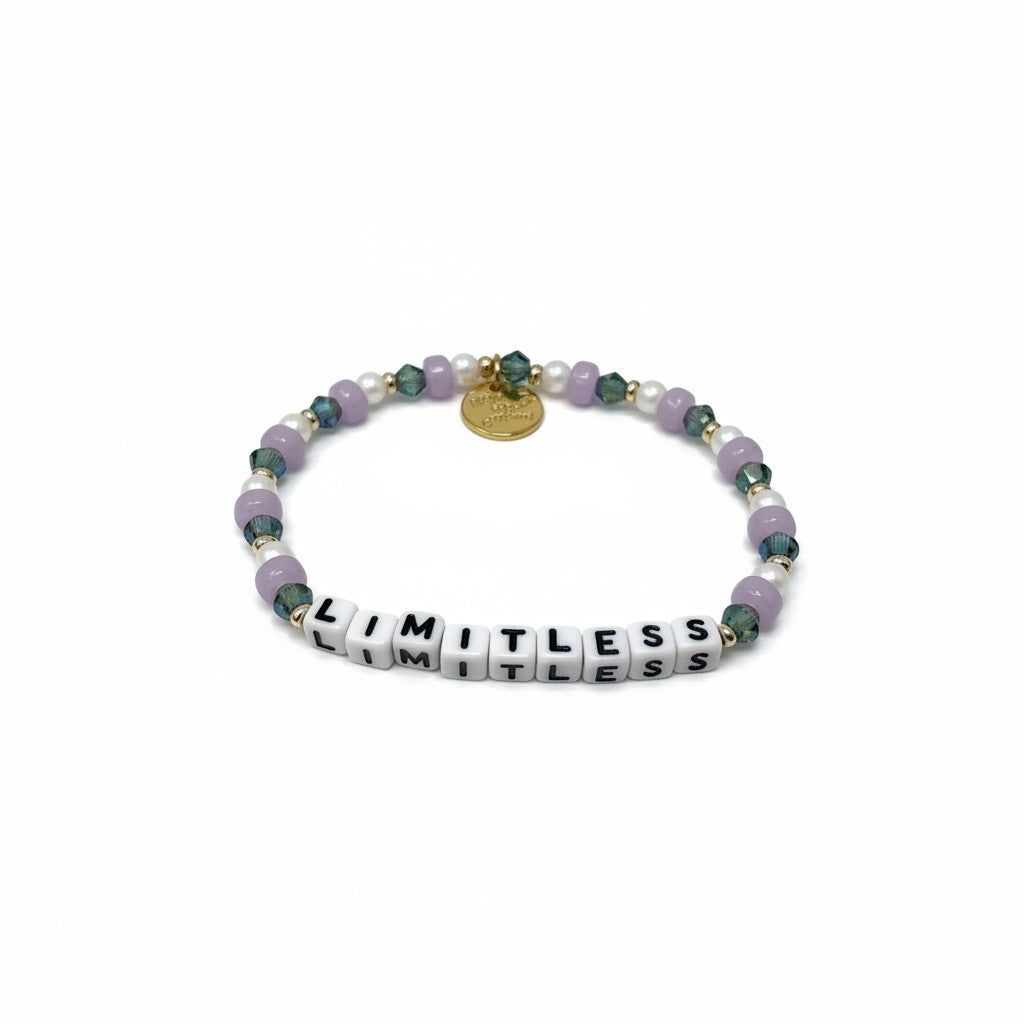 Bracelet with beads and a tag saying 'LIMITLESS' on a white background