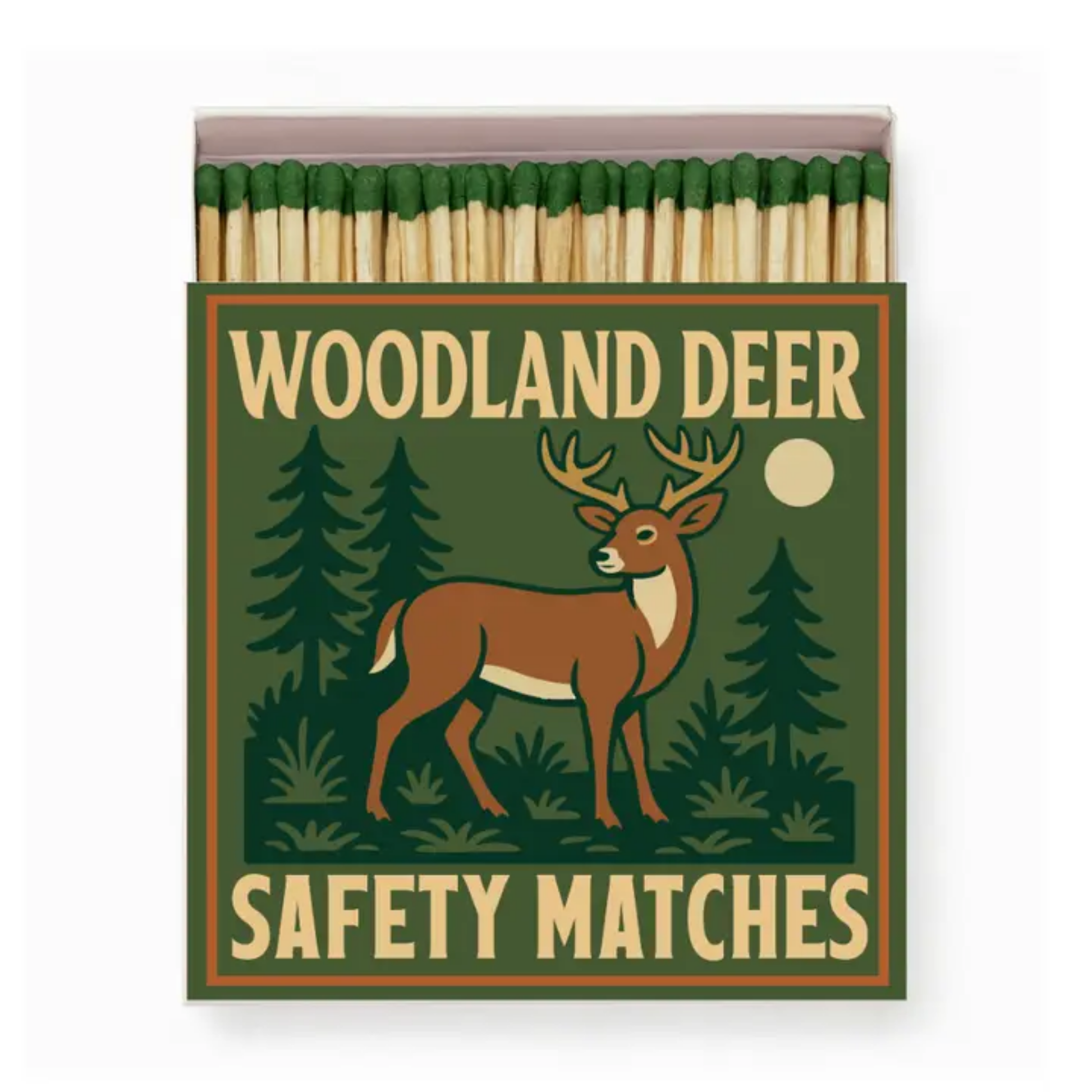 Matchbox with a design of a deer in a forest, labeled 'Woodland Deer Safety Matches'. Good & Well Supply Co.