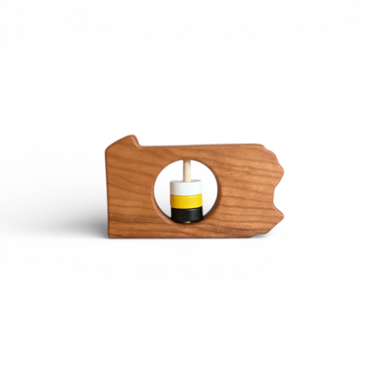 Wooden teether toy with a round center on a white background