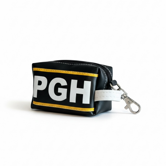 Black pouch with 'PGH' text and a keychain on a white background