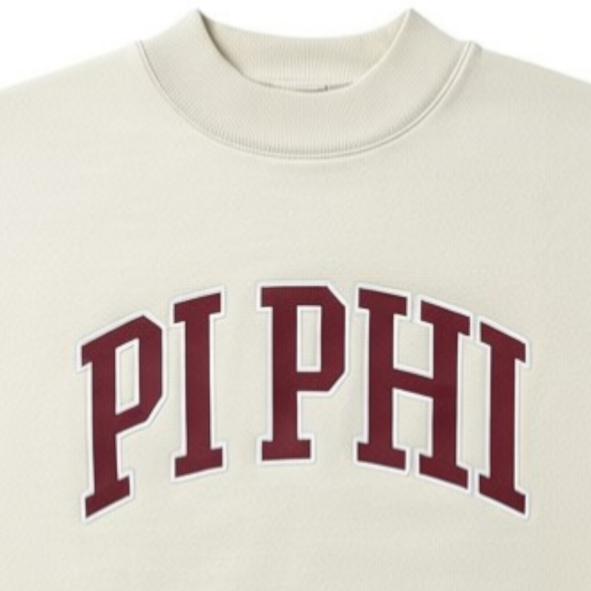 Beige sweatshirt with 'PI PHI' text in maroon on a white background