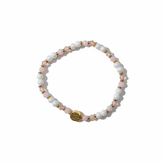 Beaded bracelet with pink and gold accents on a white background