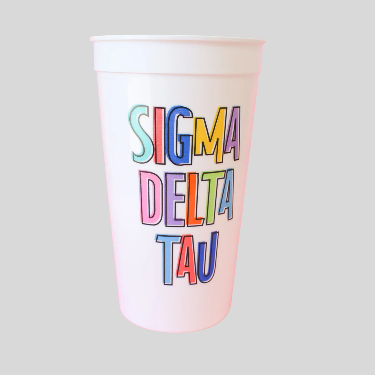 Colorful 'Sigma Delta Tau' text on a white cup against a light gray background