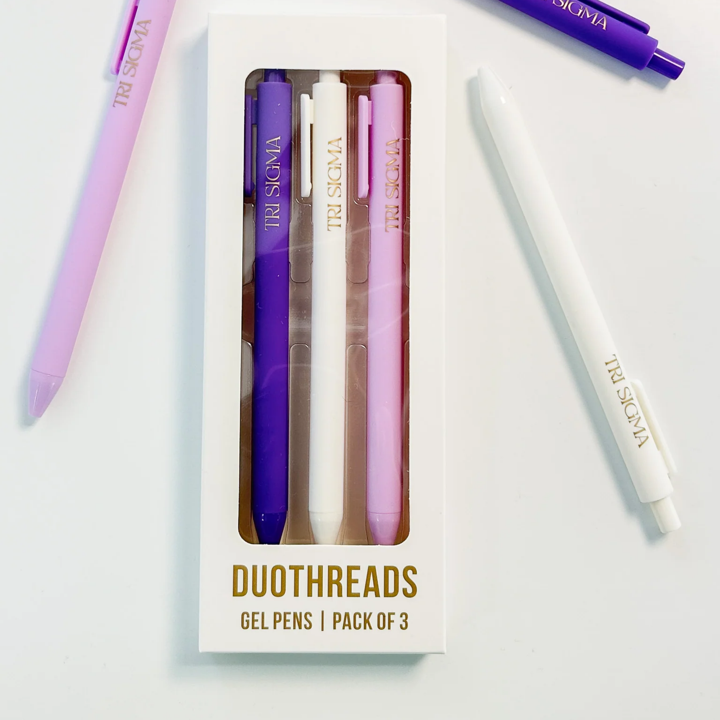 Pack of three gel pens with visible branding on a white background