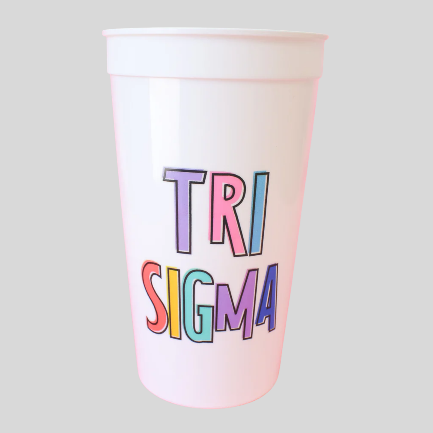 Colorful 'TRI SIGMA' text on a white cup against a light gray background