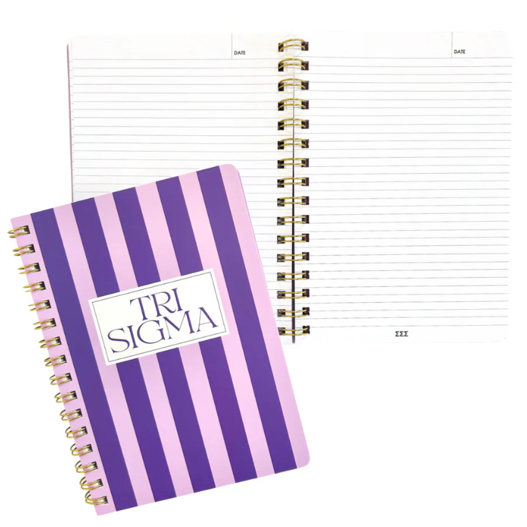 Notebook with purple and white striped cover and 'Tri Sigma' logo on a white background