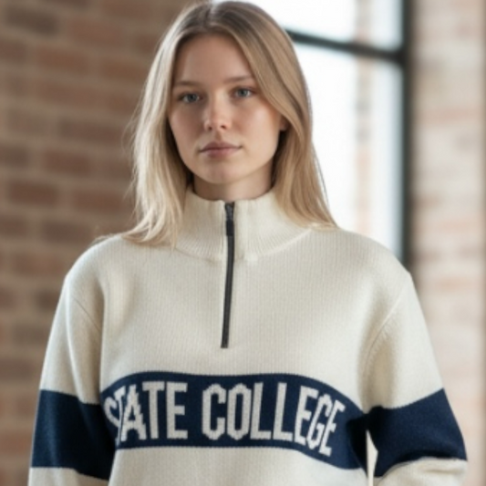 Woman wearing a cream-colored sweater with 'STATE COLLEGE' text in a casual setting.