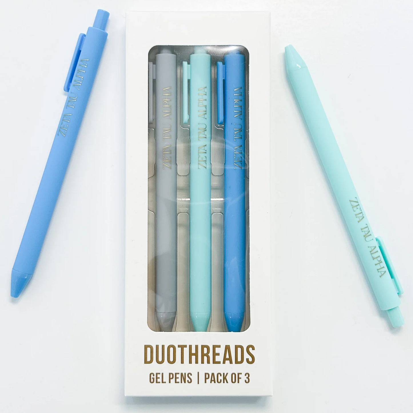 Pack of three gel pens with blue and light blue colors, one pen outside the packaging on a white background.