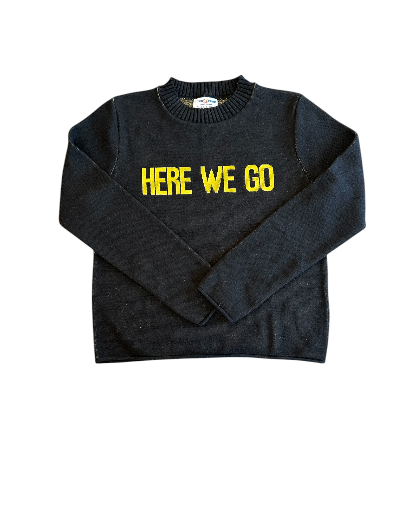 Folded black “HERE WE GO” sweater showing gold knit lettering. Recycled cotton, made in the USA by Town Pride.