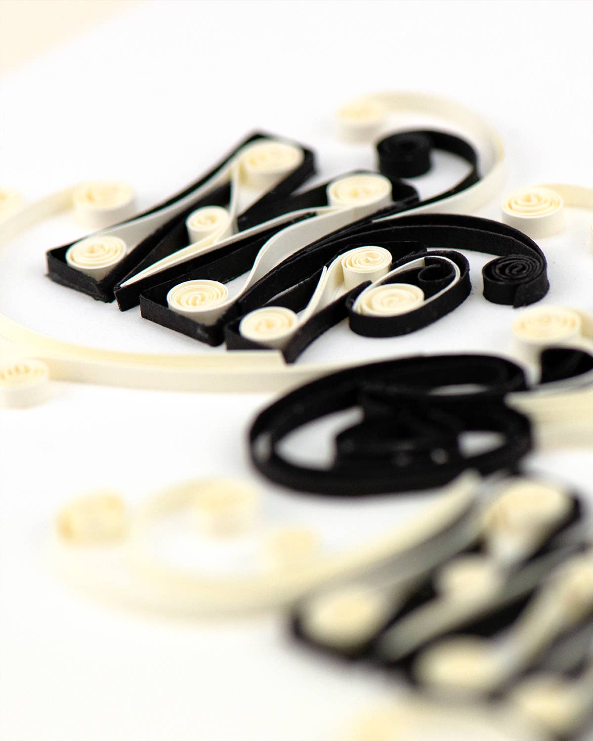 Black and white decorative letters on a white background