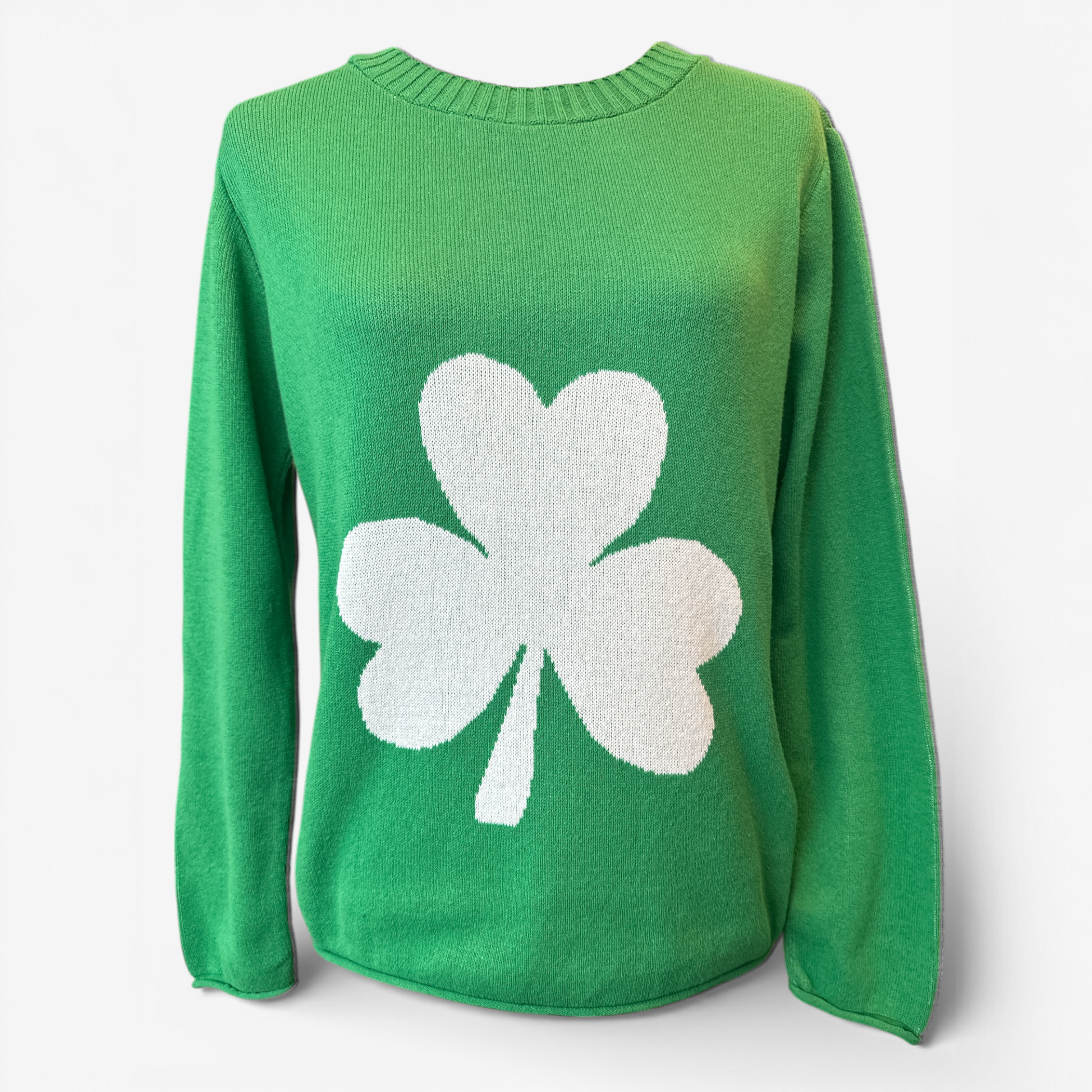 Green sweater with a white shamrock design on a white background