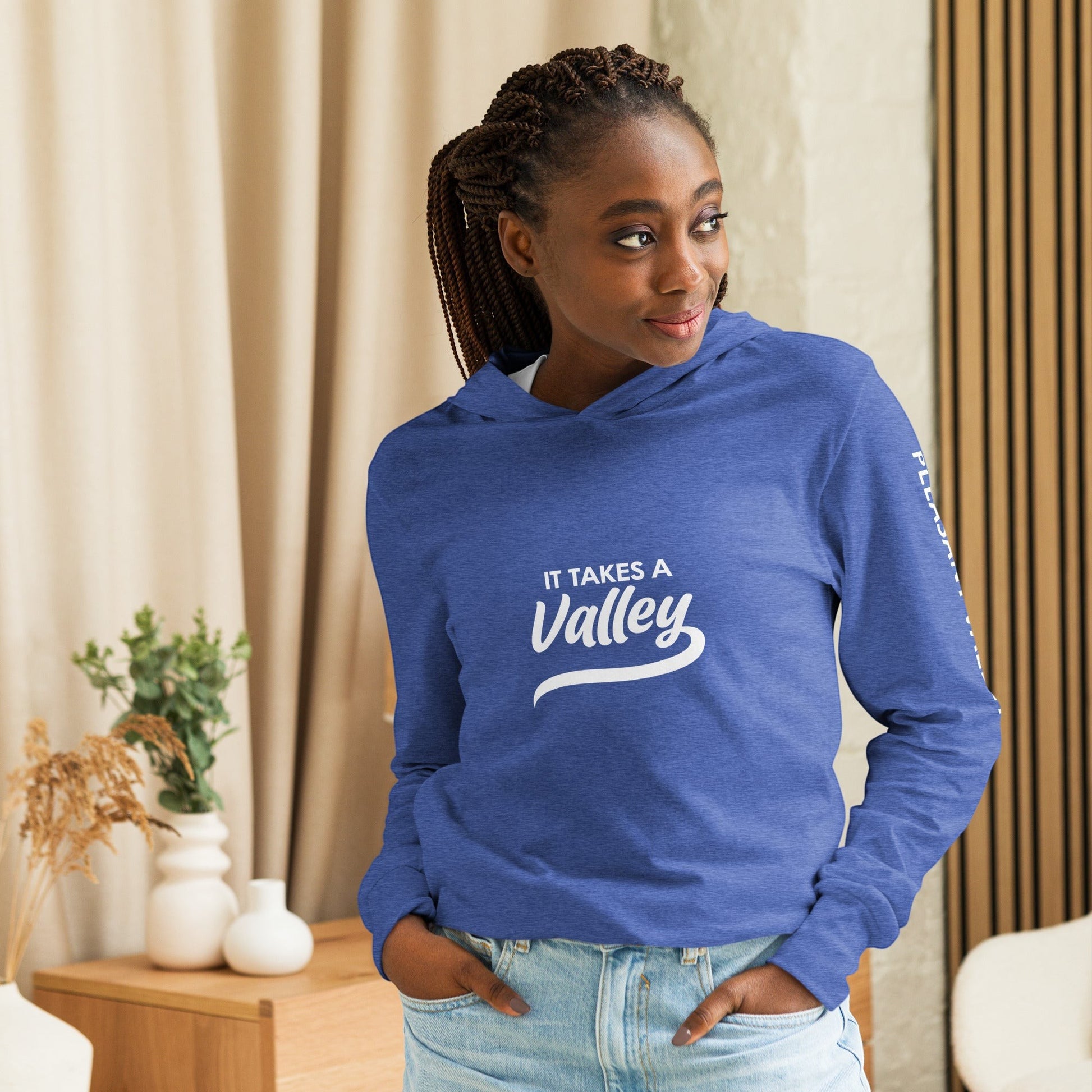 Town Pride State College blue lightweight hooded long sleeve tee with It Takes a Valley graphic on a woman