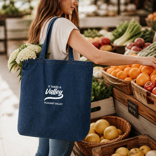 Town Pride State College organic denim tote bag with It Takes a Valley Pleasant Valley print at a farmers market