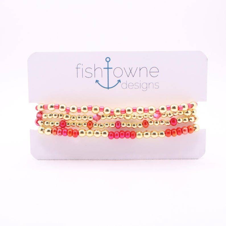 Town Pride State College hot pink and gold hematite bead stretch bracelet stack of five on a display card