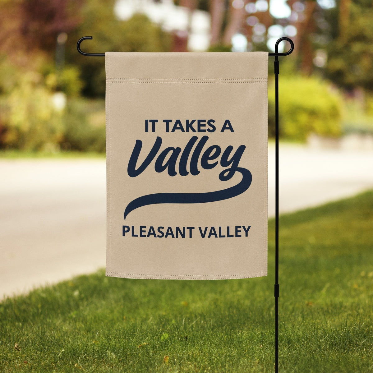 Town Pride State College It Takes A Valley Pleasant Valley garden flag in beige polyester with dark blue text.
