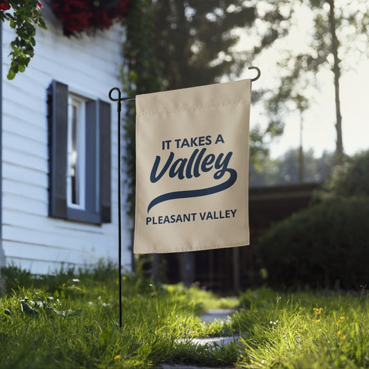 Town Pride State College It Takes A Valley Pleasant Valley garden flag in beige polyester displayed in a front yard.