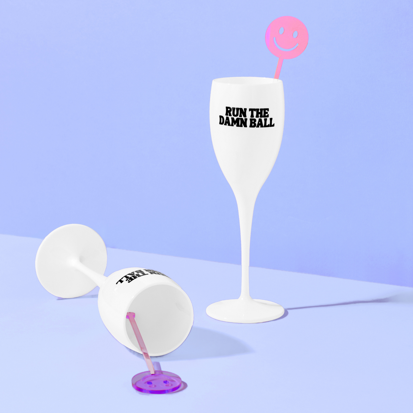 White wine glass with 'Run the Damn Ball' text on a light purple background